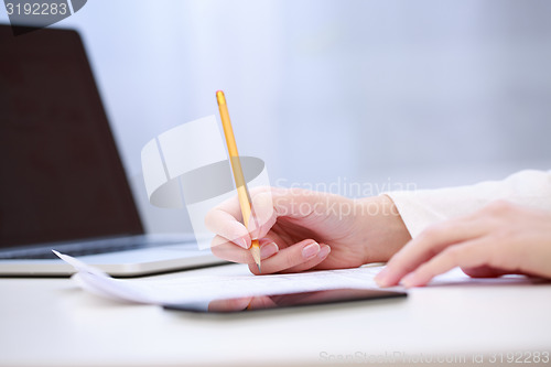 Image of Female hand writing, close up