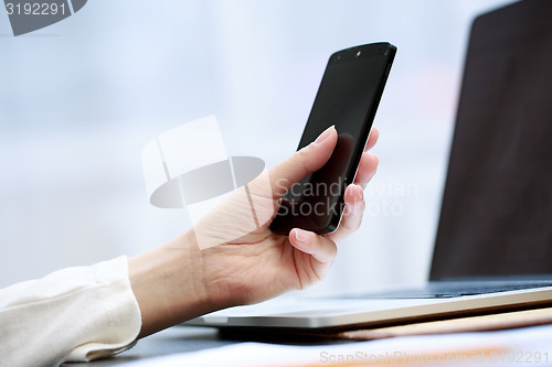 Image of Woman using a mobile phone 