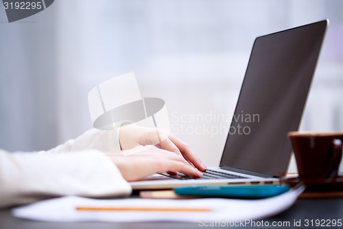 Image of Close-up shot typing on the laptop keyboard