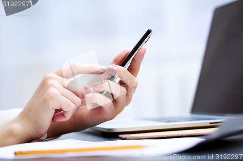 Image of Woman using a mobile phone 