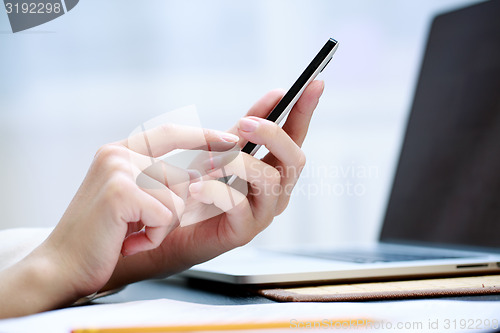 Image of Woman using a mobile phone 