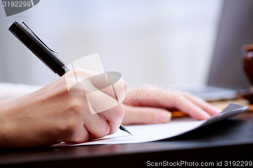 Image of Woman working with documents