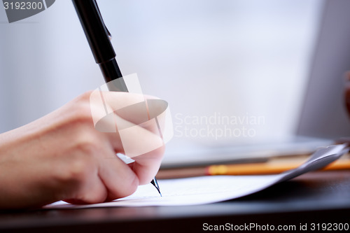 Image of Woman working with documents