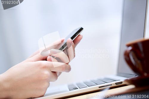 Image of Close up of a woman using smartphone