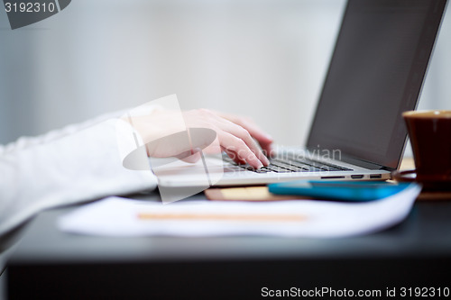 Image of Close-up shot typing on the laptop keyboard