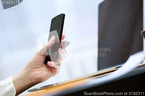 Image of Woman using a mobile phone 