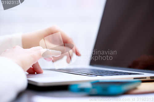 Image of Close-up shot typing on the laptop keyboard