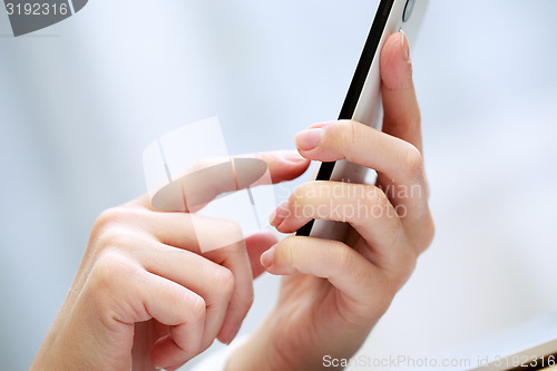 Image of Woman using a mobile phone 