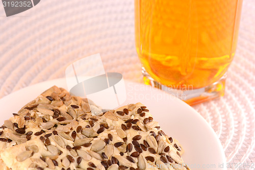 Image of sweet cake on white plate with fresh juice