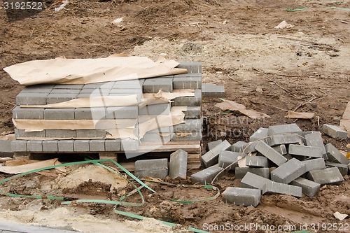 Image of Elements of paving slabs lying on the ground
