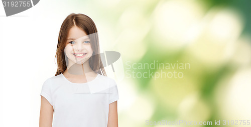 Image of smiling little girl in white blank t-shirt
