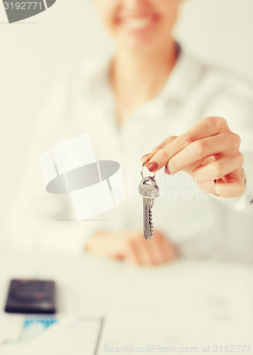 Image of woman hand holding house keys