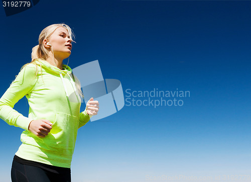 Image of woman doing running outdoors
