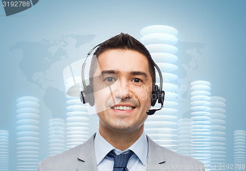 Image of smiling businessman in headset over bit coin