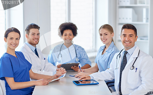 Image of group of happy doctors meeting at hospital office