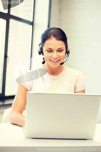 Image of helpline operator with laptop computer