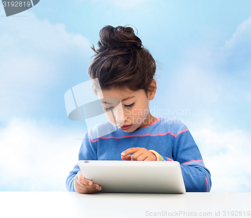 Image of little girl with tablet pc over sky background