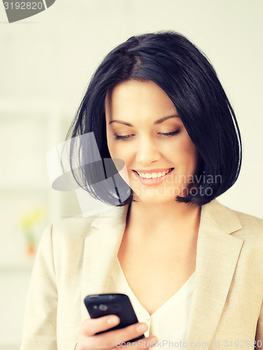 Image of businesswoman with cell phone