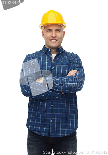 Image of smiling male builder or manual worker in helmet