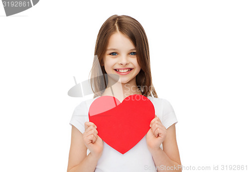 Image of smiling little girl with red heart