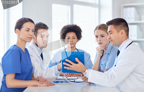 Image of group of happy doctors meeting at hospital office