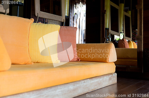 Image of couch with pillows at hotel room or home