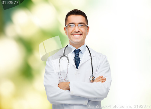 Image of smiling male doctor in white coat