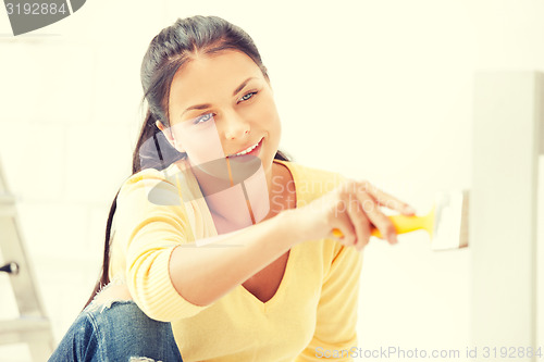 Image of lovely housewife painting