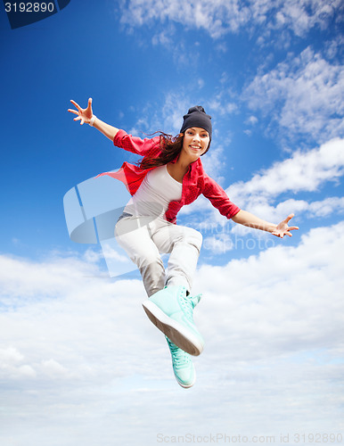 Image of beautiful dancing girl jumping