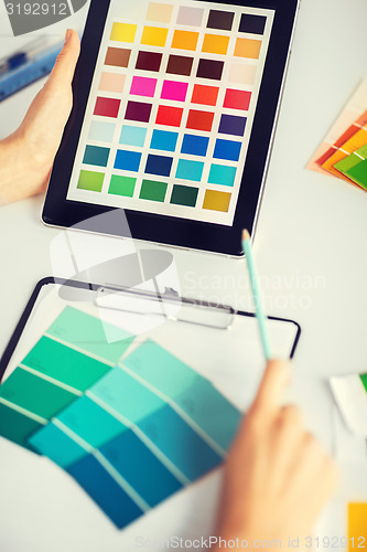 Image of woman working with color samples for selection