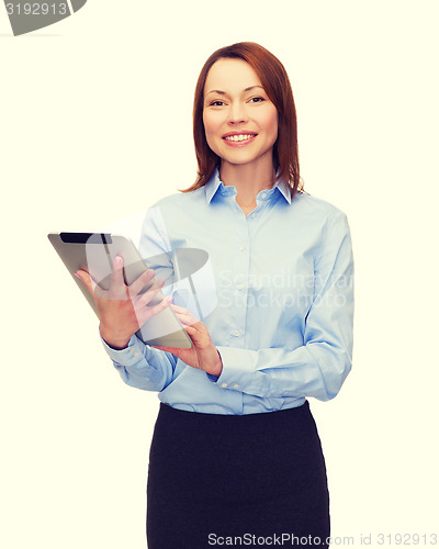 Image of smiling woman looking at tablet pc