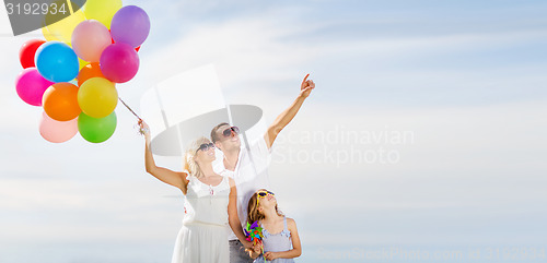 Image of family with colorful balloons