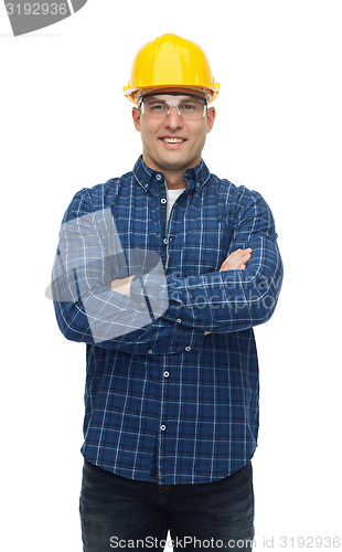 Image of smiling male builder or manual worker in helmet