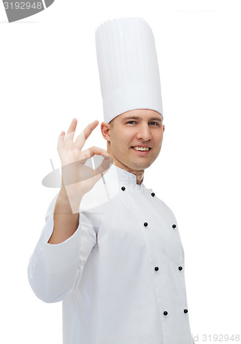 Image of happy male chef cook showing ok sign