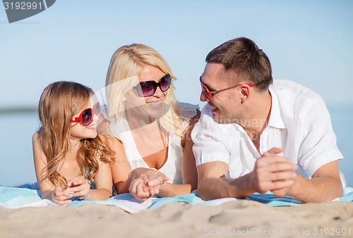 Image of happy family on the beach