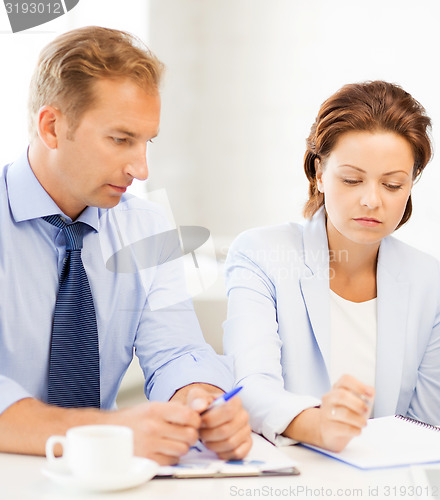 Image of business team discussing something in office