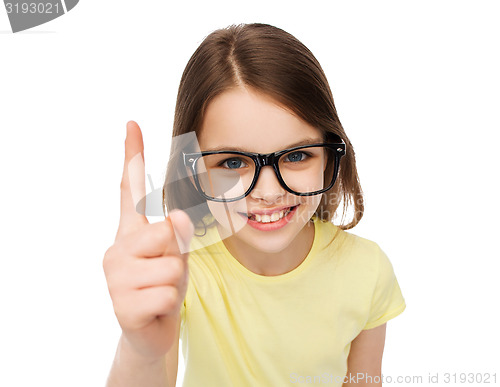 Image of smiling cute little girl in black eyeglasses