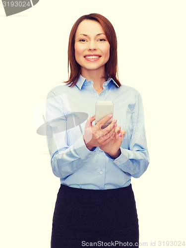 Image of young smiling businesswoman with smartphone