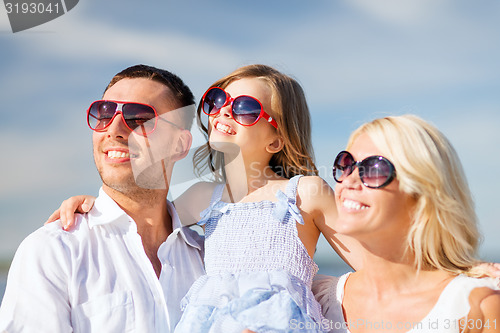 Image of happy family with blue sky