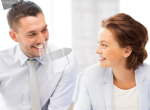 Image of business team discussing something in office