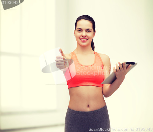 Image of sporty woman with tablet pc computer