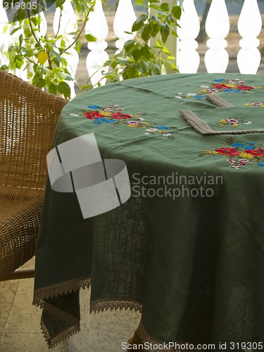 Image of SUnny interrior with table and chair