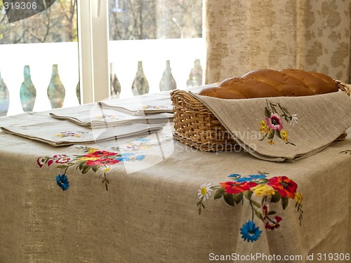 Image of Table with bread and table-cloth