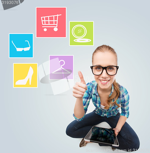 Image of smiling woman with tablet pc computer at home