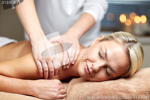 Image of close up of woman lying and having massage in spa