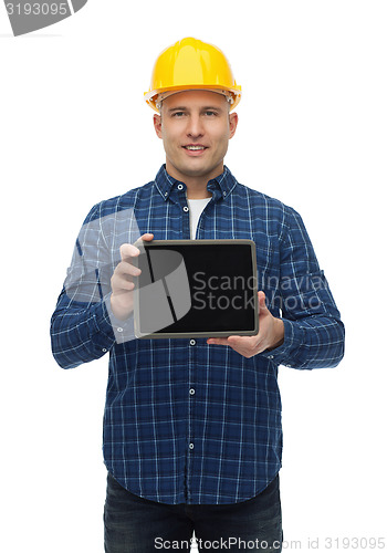 Image of smiling male builder in helmet with tablet pc