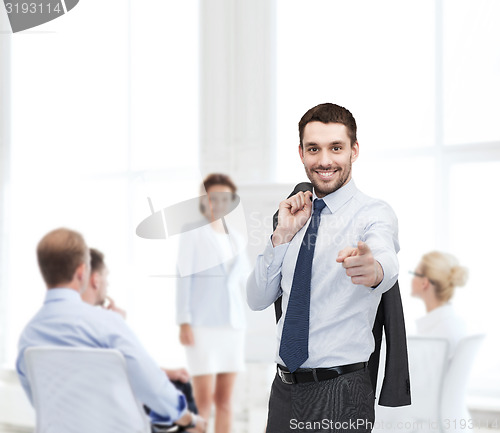 Image of handsome buisnessman with jacket over shoulder