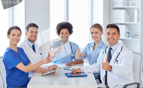 Image of group of happy doctors meeting at hospital office