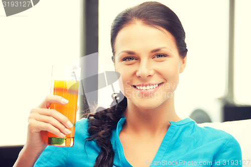 Image of beautiful woman with glass of juice