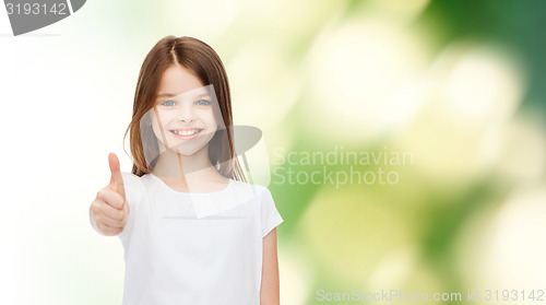 Image of smiling little girl in white blank t-shirt